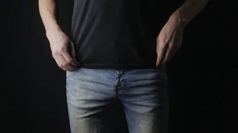 Man Turns the Empty Pockets of His Jeans. No Money Stock Footage 85242068