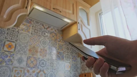 Man turns on the extractor hood Stock Footage 163991843