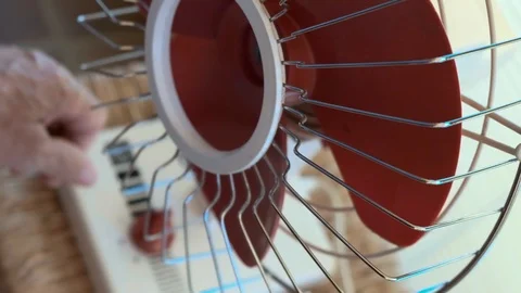 A man turns on a fan Stock Footage 112617650