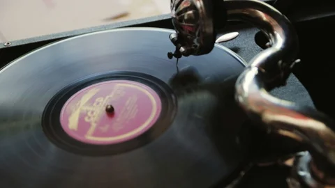 The man turns on the gramophone Stock Footage 128042492