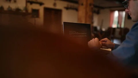 Man turns on a laptop waits for loading computer and finds out it is infected by Stock Footage 84858436
