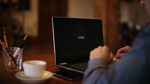 Man turns on a laptop waits for loading computer and finds out it is infected by Stock Footage 84858582