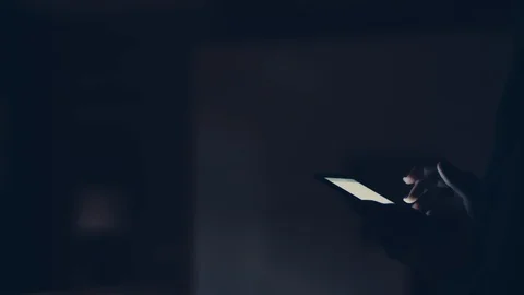 Man Turns On The Light Through The Smartphone Stock Footage 127948553