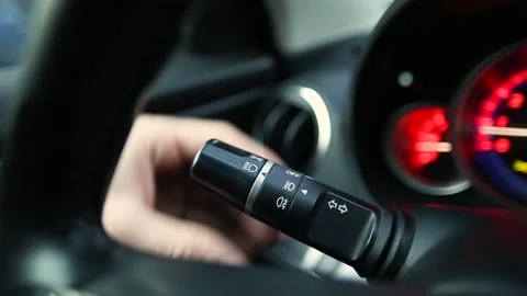 Man turns on the lights in the car Stock Footage 170555562