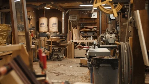 Man turns on lights in workshop Stock Footage 102045598