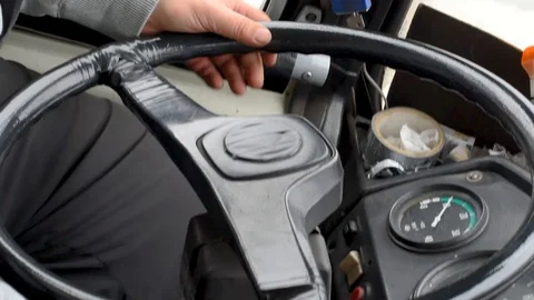 The man turns the old steering wheel taped Stock Footage 108012316