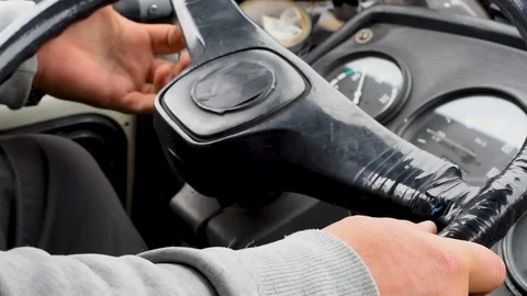 The man turns the old steering wheel taped Stock Footage 108012317