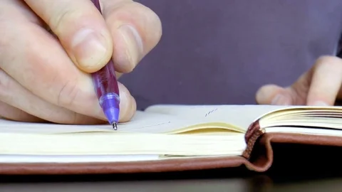 Man turns over the book Stock Footage 79539887