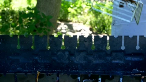 Man turns over the roasted assorted vegetables on the barbecue. Stock Footage 240131194