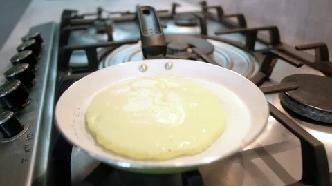 The man turns the pancake Stock Footage 82259992