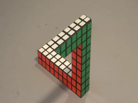 Man turns Penrose Triangle illusion into puzzle Stock Footage 106299186