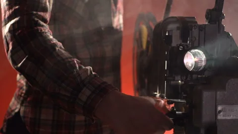 A man turns off a projector that is in smoke Stock-Footage 86229737