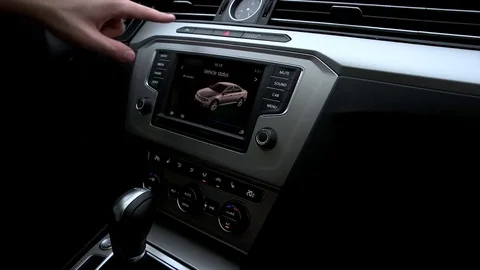 Man turns on the rear view camera in the car Stock Footage 73941172