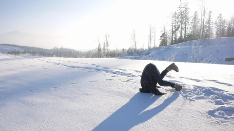 Man turns somersaults in the snow Stock Footage 72747560