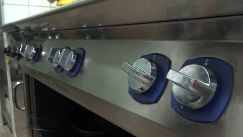 A man turns on a stove - closeup on the knobs 스톡 동영상 82682142