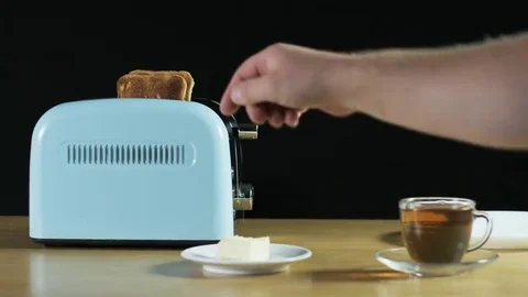 Man Turns the Toaster On Stock Footage 69177531