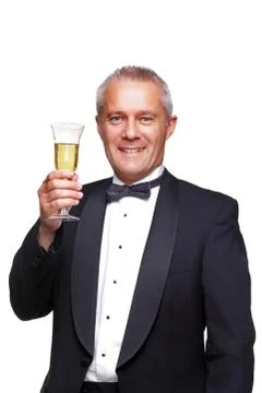 Man in tuxedo toasting with champagne. Stock Photos