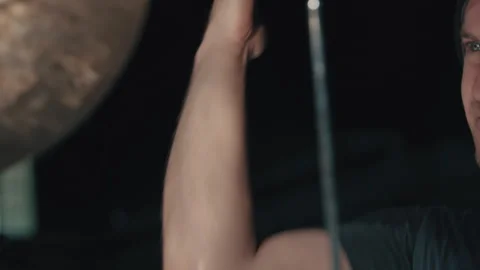 Man twirling his drumsticks while he plays in dark room Stock Footage 275102053