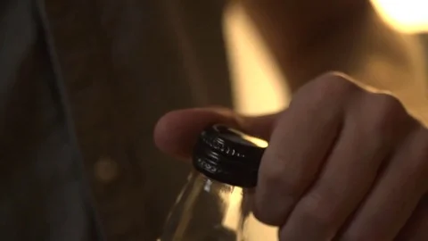 Man Twisting Cap Off of Bottle Stock Footage 83525279