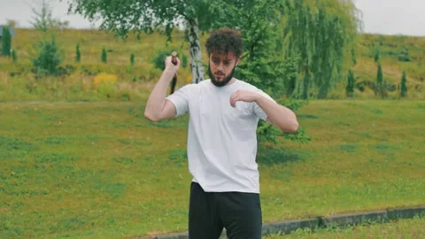 Man twists nunchucks Stock Footage 159990267