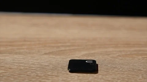 The man twists the screws into the button using a screwdriver. Stock Footage 86437673