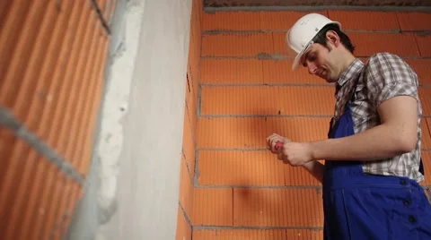 Man twists the screws with a screwdriver Stock Footage 61728040