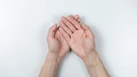 Man two hands with palms up on a white background. Stock Photos