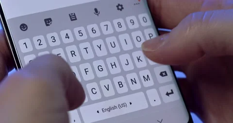 A man with two hands prints a message on a smartphone Video stock 149937116