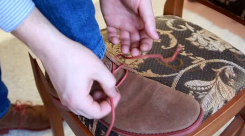 Man tying brown shoes Stock Footage 47434552