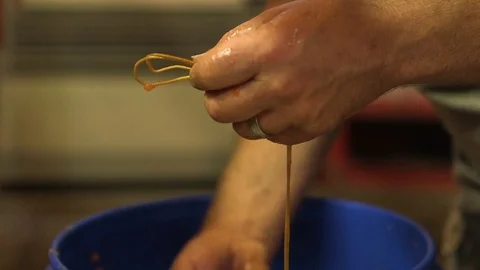 Man tying fish fillets on the rope 스톡 동영상 83179722