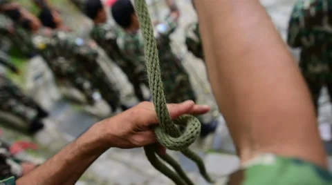 Man tying a knot Stock Footage 64934378