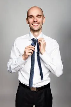 Man Tying a Necktie Stock Photos