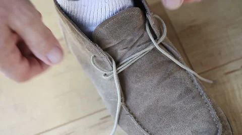Man tying shoe Stock Footage 42771272