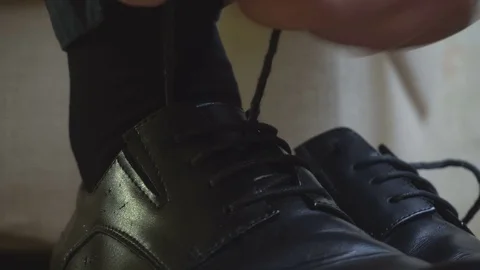 Man tying shoe laces Stock Footage 69766756