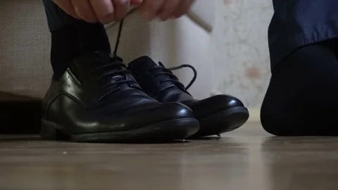 Man tying shoe laces Stock Footage 69767032