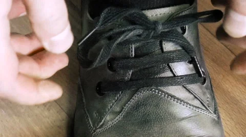Man tying shoelaces Stock Footage 68386644