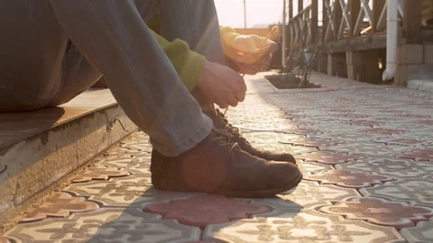 Man tying shoelaces Stock Footage 128795924