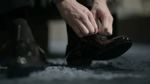 Man tying shoes. Stock Footage 33128747