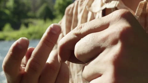 Man tying a snell knot on hook 動画素材 59899497