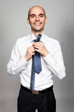 Man Tying a Tie Stock Photos