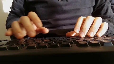 A man type the keys of a computer keyboard Video stock 99330077