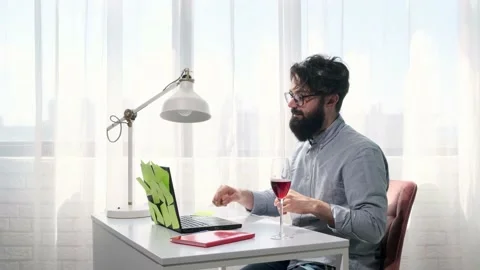 Man types and then presses the enter button and looks happily at the screen. Stock Footage 152257449