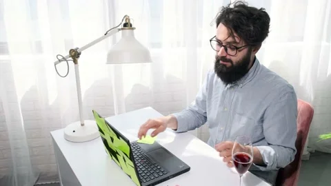Man types and then presses the enter button and looks happily at the screen. Stock Footage 153165690