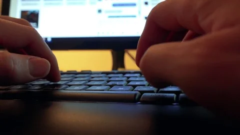 A man types on a computer - closeup on the hands 動画素材 74674722