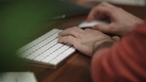 Man types on computer Stock Footage 128773374