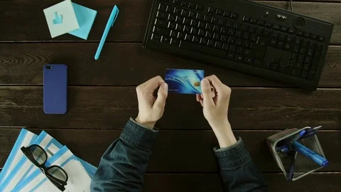 A man types on a computer keyboard on his desk. Stock Footage 82006389