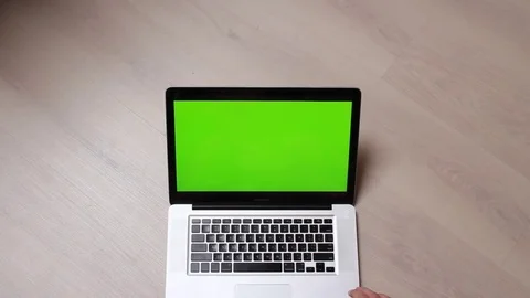 Man Types On Green Screen Laptop In Home Office Stock Footage 78984695