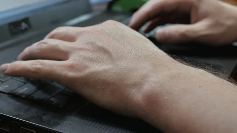A man types on the keyboard text, closeup. Stock Footage 128172203