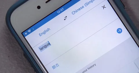 Man types the keyword "Language" to translate into Chinese in Google Translation Stock Footage 150036733
