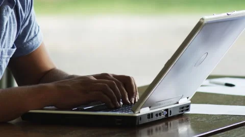 Man Types on Laptop. Co-workers look on. 스톡 동영상 62920203